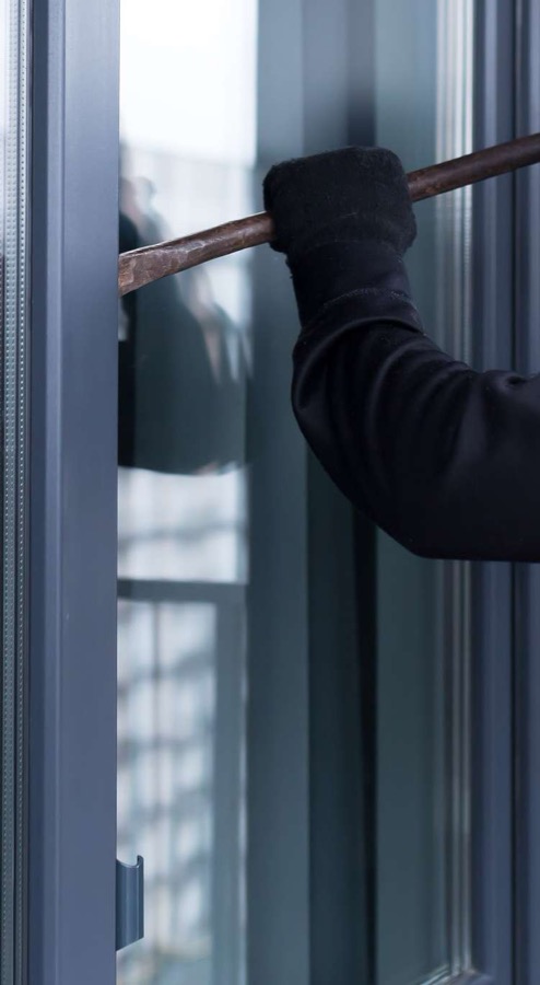 Hand on a secure door handle